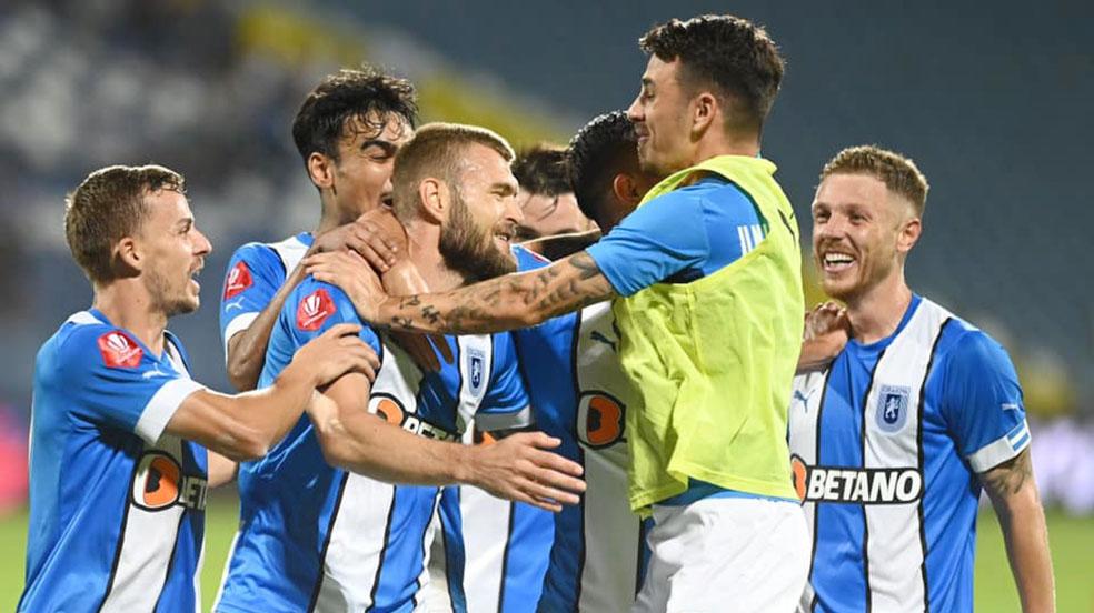 Universitatea Craiova se află pe locul 6 în Superligă după 12 etape, dar are un meci mai puțin, restanța cu Chindia, din Etapa a 6-a, meciul fiind programat, la Târgoviște, pe 29 noiembrie
